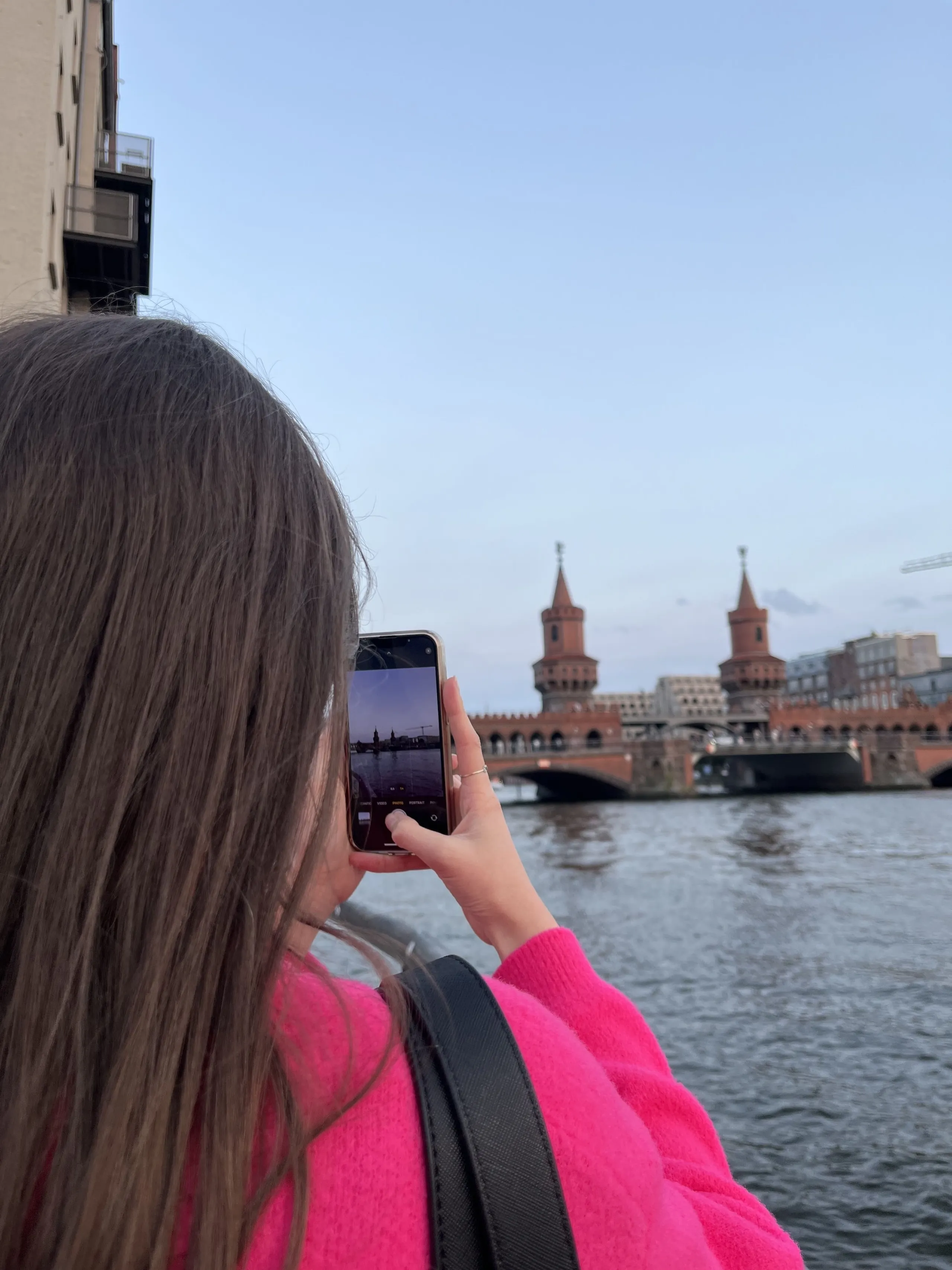 Vittoria taking a photo of the Oberbaum bridge in Berlin, Germany.